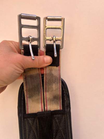 Black girth with elasticated buckles end