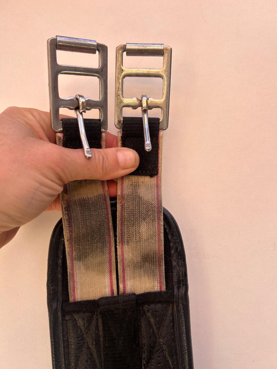 Black girth with elasticated buckles end